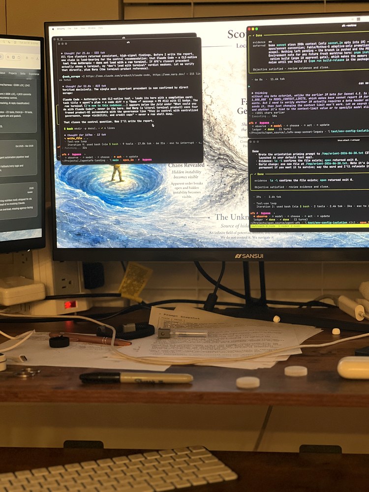 Dual monitors glowing in a dim room — the workspace where the agent tooling gets built